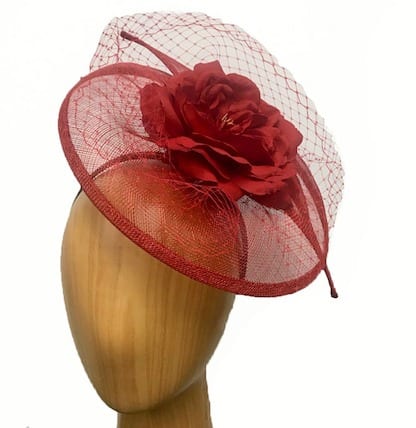 red fascinator with flower