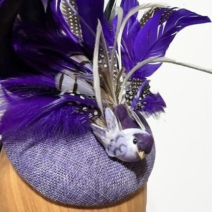 purple bird feathered fascinator